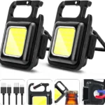 Super Bright LED multi-tool flashlight attached to a keychain, showing the integrated bottle opener and the folding bracket stand used for hands-free positioning of the portable light.