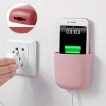 "Wall-mounted phone and remote holder storage box for smartphones, remote controls, and accessories"