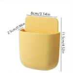 "Wall-mounted phone and remote holder storage box for smartphones, remote controls, and accessories"