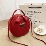 Trendy round crossbody bag for women with quilted design and long strap – available in 7 colors
