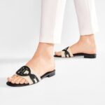 A pair of casual, wide-strap slides, inspired by Ralph Lauren, shown in either black or brown on a clean background.