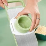 Multi-functional stainless steel grater and vegetable cutter, showing the various grating and slicing surfaces of the durable kitchen food preparation tool.