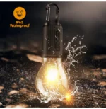 Compact, waterproof LED camping light and tent lantern with an integrated hook, showing its USB Type-C charging port and 100 Lumens brightness rating.
