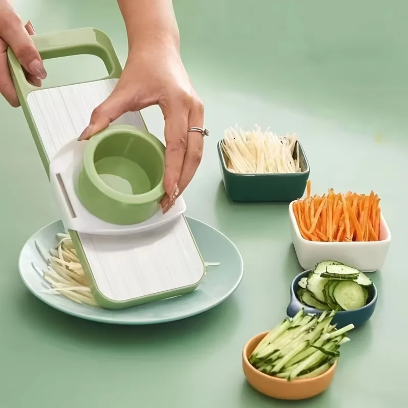Multi-functional stainless steel grater and vegetable cutter, showing the various grating and slicing surfaces of the durable kitchen food preparation tool.
