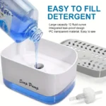 Large capacity liquid soap dispenser for kitchen sinks, shown dispensing dish detergent from its pump mechanism for easy access.