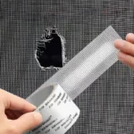 Roll of waterproof, self-adhesive screen repair tape showing the mesh texture, used to patch a hole in a window or door anti-insect mosquito screen.