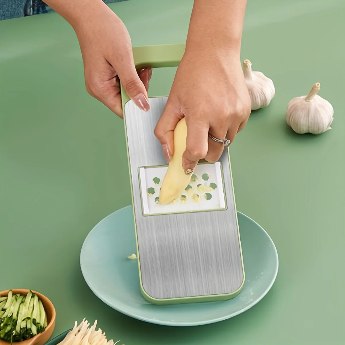 Stainless-Steel-Vegetable-Grater-Cutter-Multi-functional-Shredder.jpg Multi-functional stainless steel grater and vegetable cutter, showing the various grating and slicing surfaces of the durable kitchen food preparation tool.