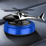 Solar power car air freshener with a decorative rotating propeller fan, designed to sit on the center console or dashboard as a perfume aromatherapy diffuser.