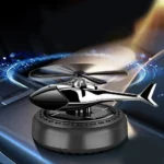 Solar power car air freshener with a decorative rotating propeller fan, designed to sit on the center console or dashboard as a perfume aromatherapy diffuser.