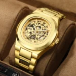 Men's automatic mechanical watch with a skeleton (hollow) steampunk dial, full silver stainless steel bracelet and case, and visible blue mechanism components.